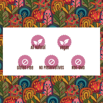 Two rows of icons on a background of brightly colored, stylized trees.

Top row: a pink medal, with two white leaves in the middle, labeled “all natural.” A second pink medal, with two white leaves in the middle, labeled “vegan.”

Bottom row: three pink medals, each with a white prohibition sign in the center. From left to right, icons are labeled “gluten free,” “no preservatives,” “non-gmo.”
